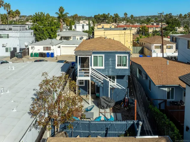 a view of multiple houses with a street