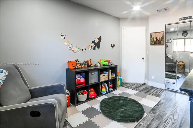 a room with furniture and a wooden floor