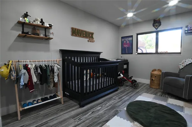 a bedroom with furniture and a window