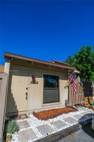 a view of a backyard of the house