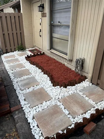 a view of a sign board with a yard