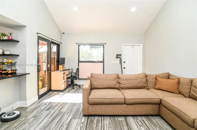 a living room with furniture and a couch