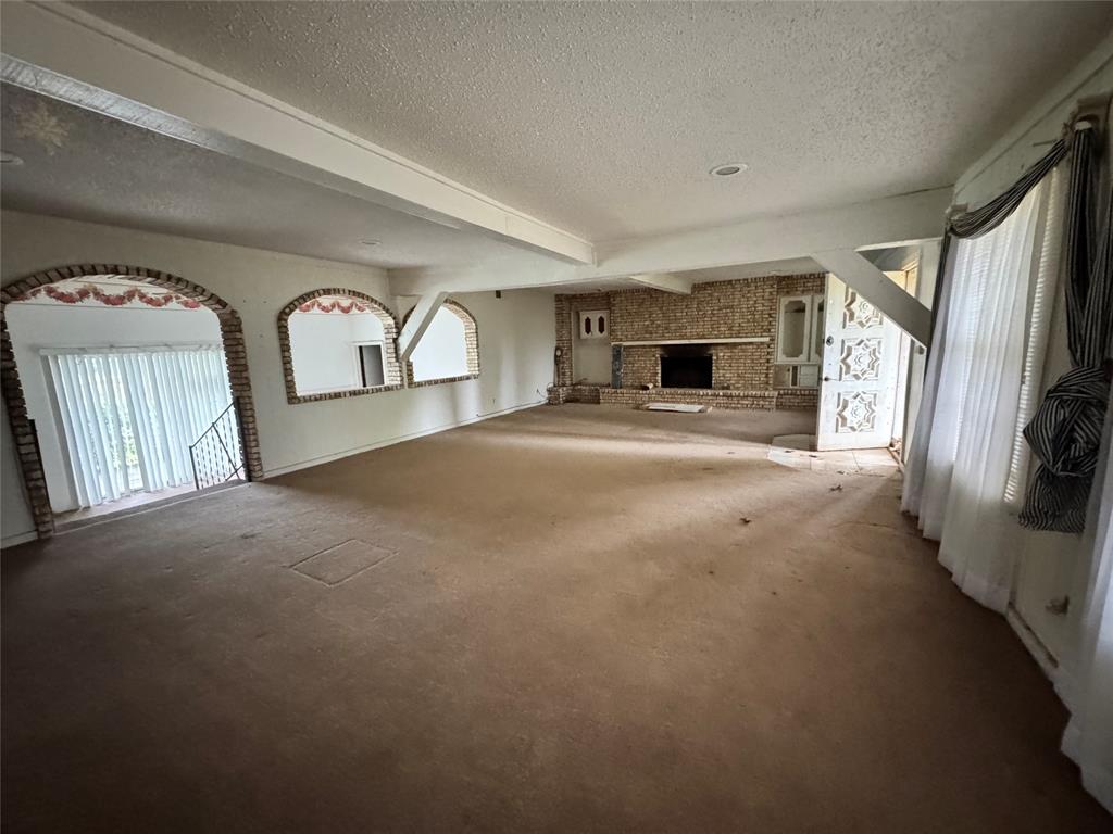 3909 Smothers Road Caney City, TX 75148 - Photo 6 of 35 a view of a livingroom with a fireplace