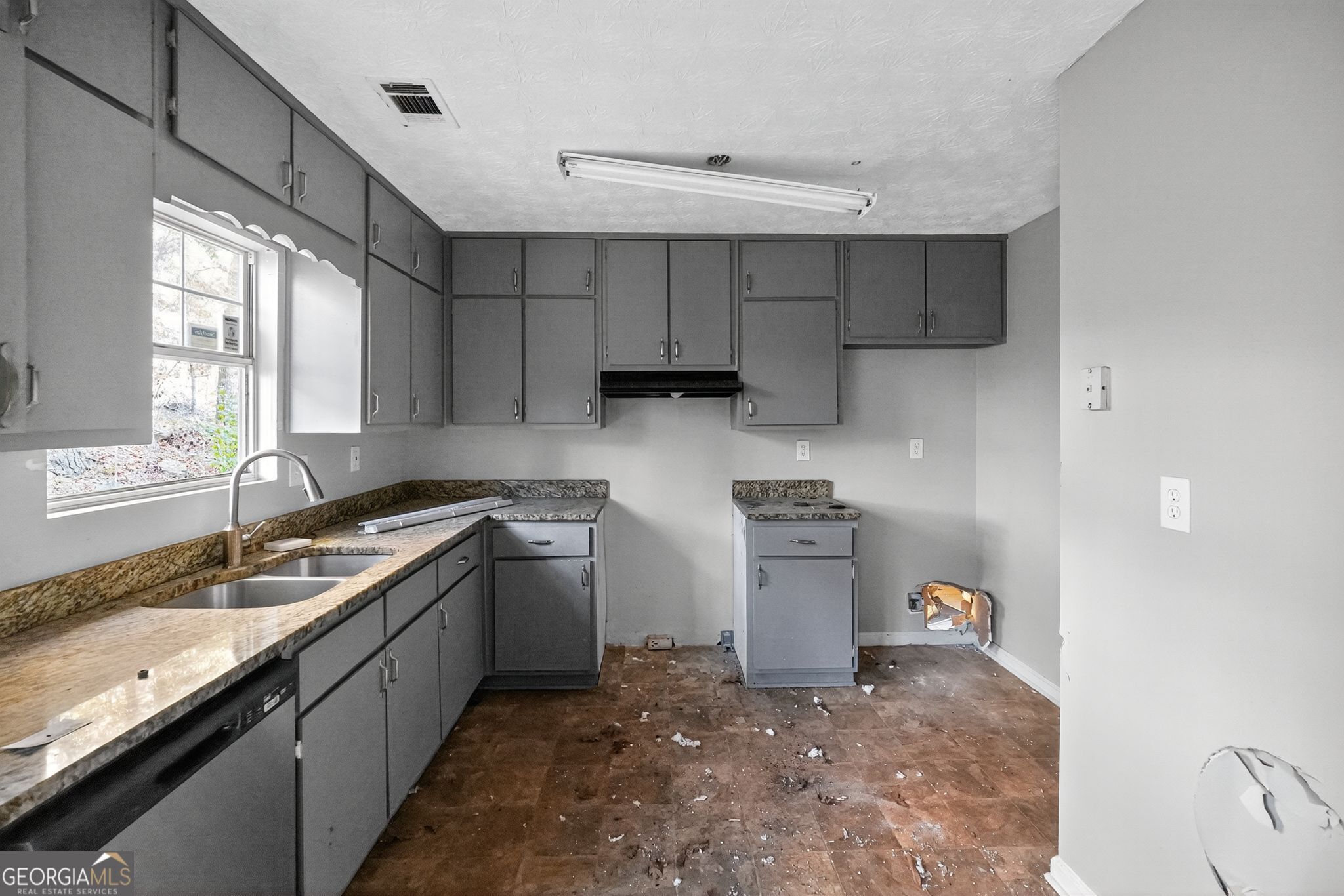 3840 Rolling Place Conley, GA 30288 - Photo 14 of 35 a kitchen with a sink stove top oven and cabinets