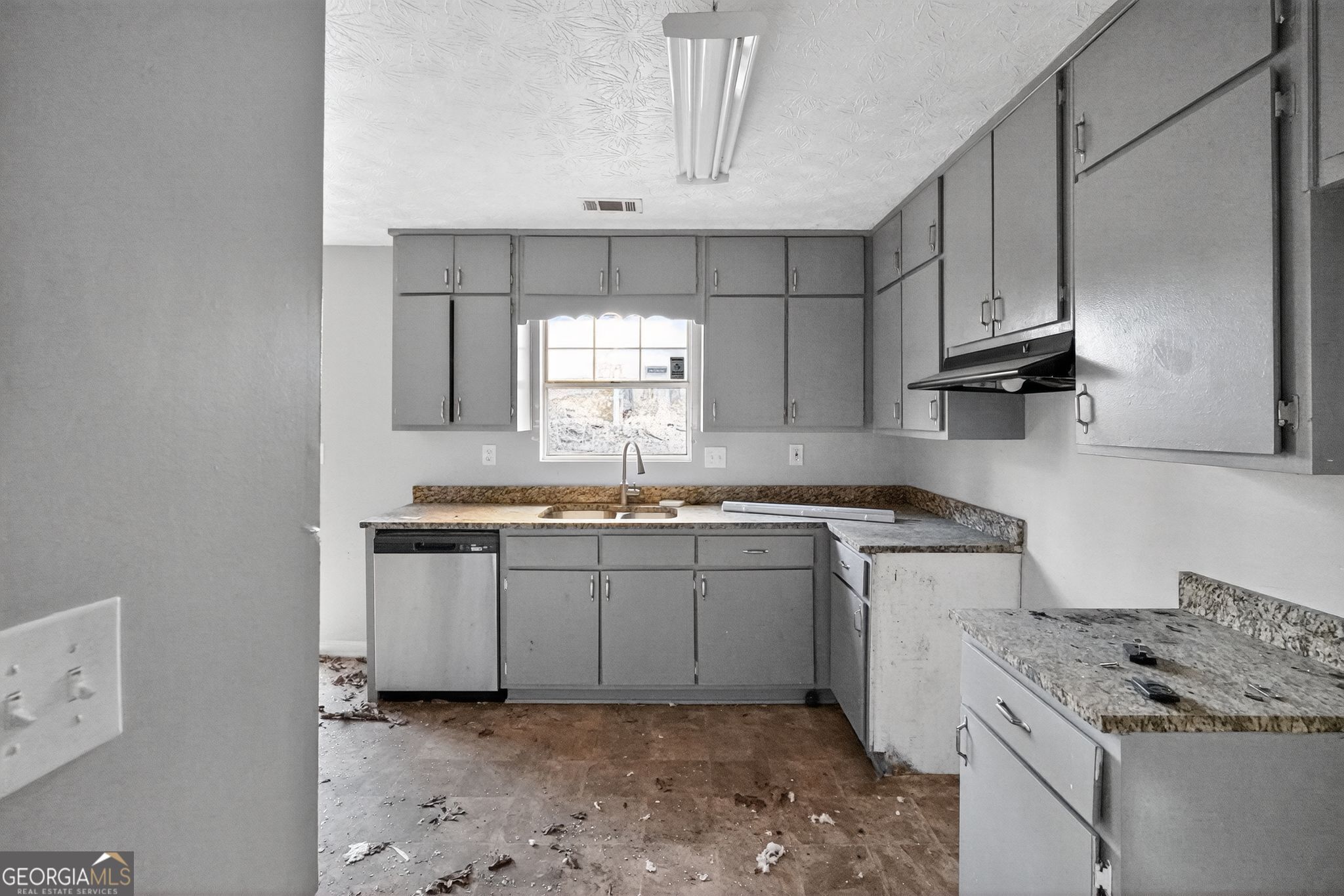 3840 Rolling Place Conley, GA 30288 - Photo 16 of 35 a kitchen with granite countertop a sink stove and cabinets