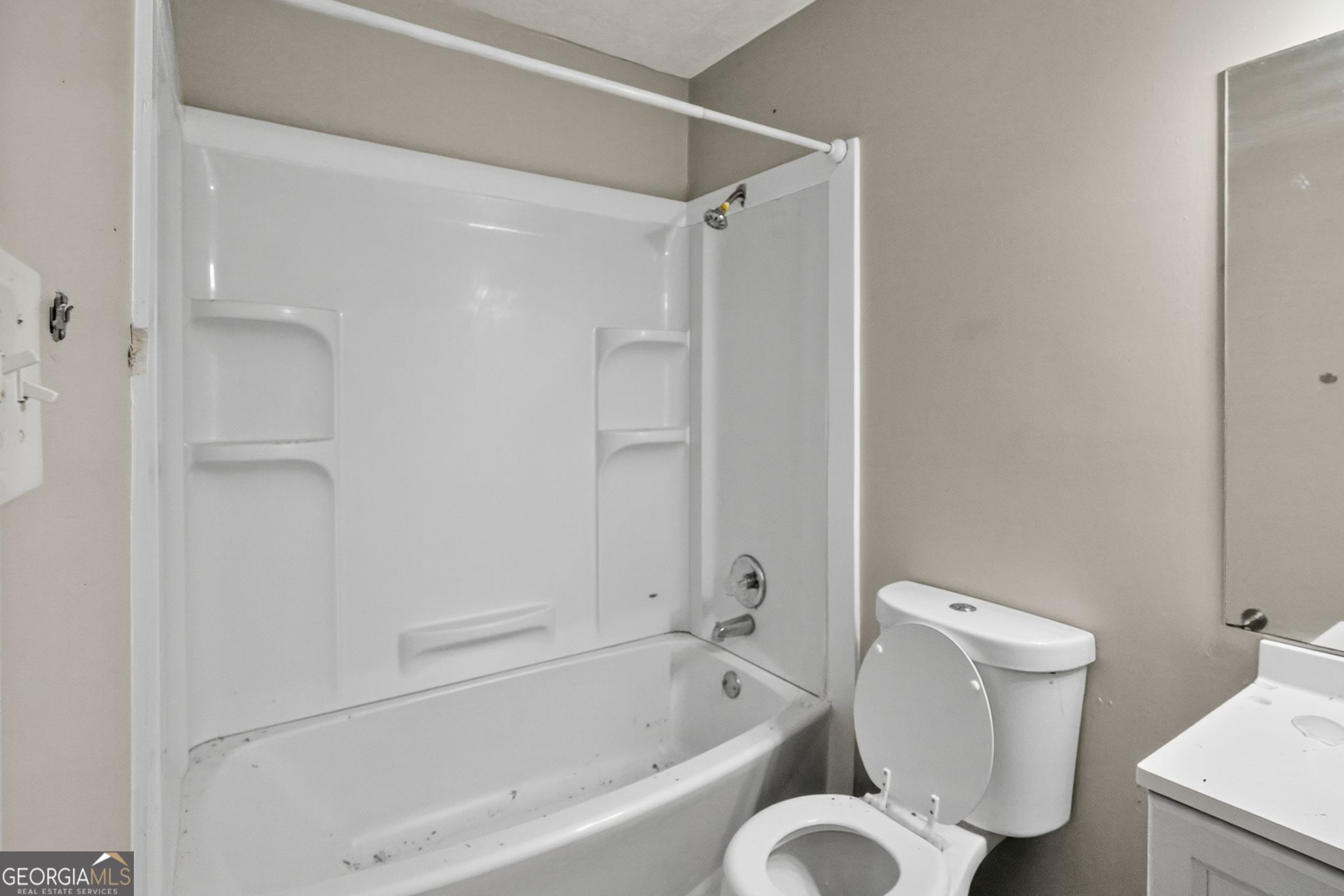 3840 Rolling Place Conley, GA 30288 - Photo 27 of 35 a bathroom with a toilet and a bathtub