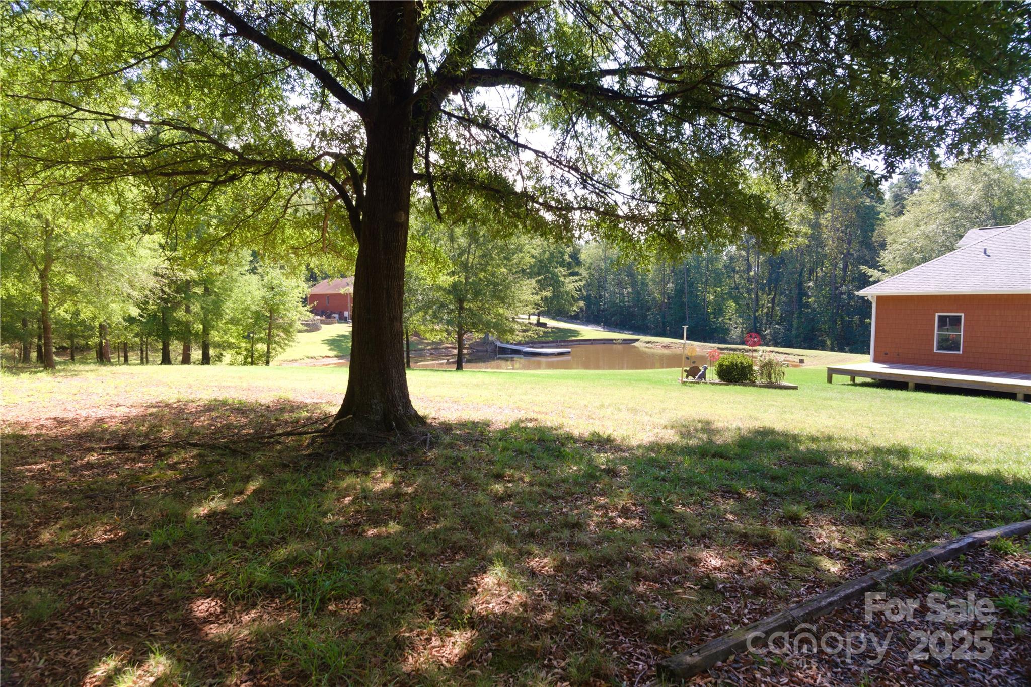 15027 Beatties Ford Road Huntersville, NC 28078 - Photo 11 of 34 a view of yard with trees