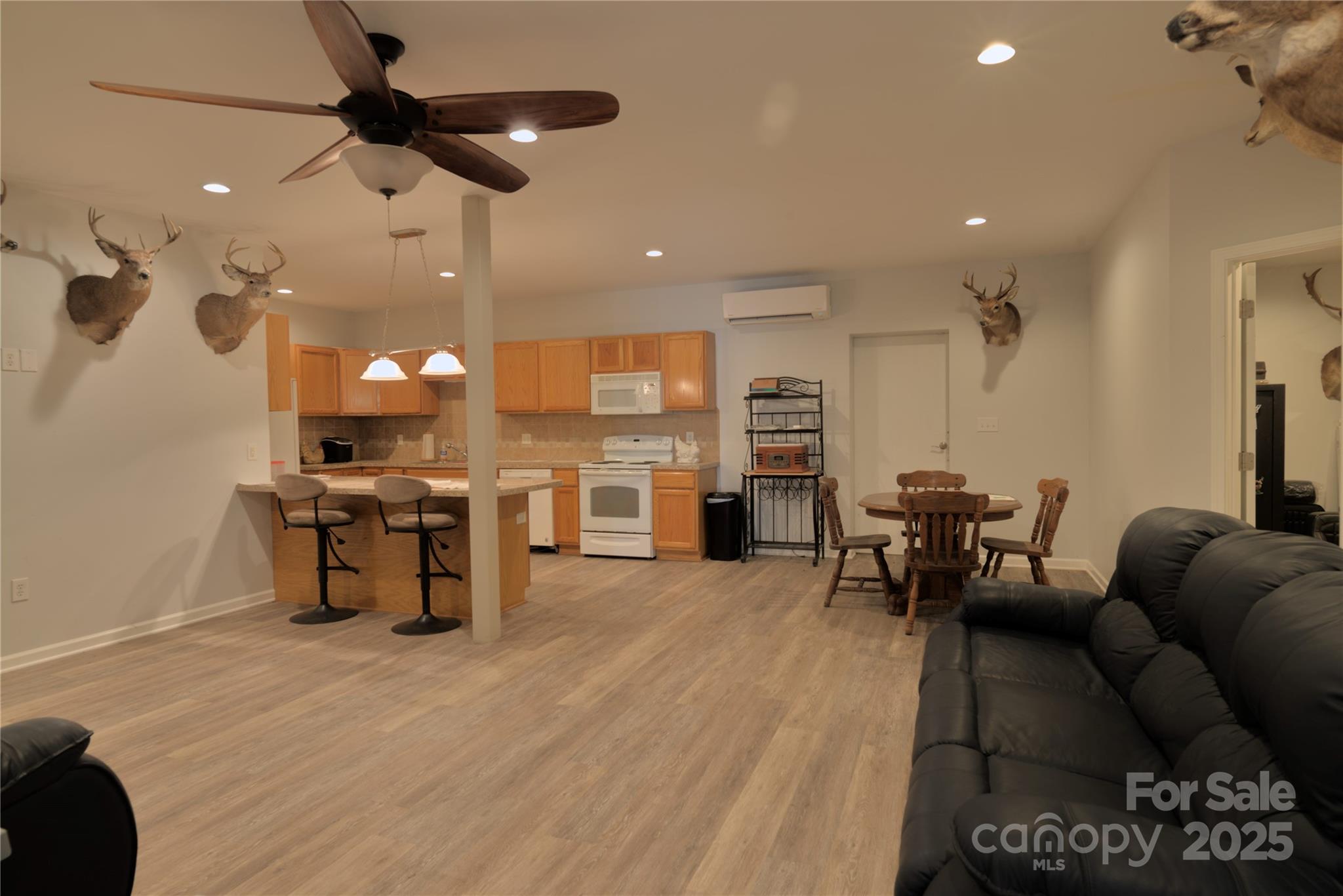 15027 Beatties Ford Road Huntersville, NC 28078 - Photo 14 of 34 a living room with furniture and kitchen view