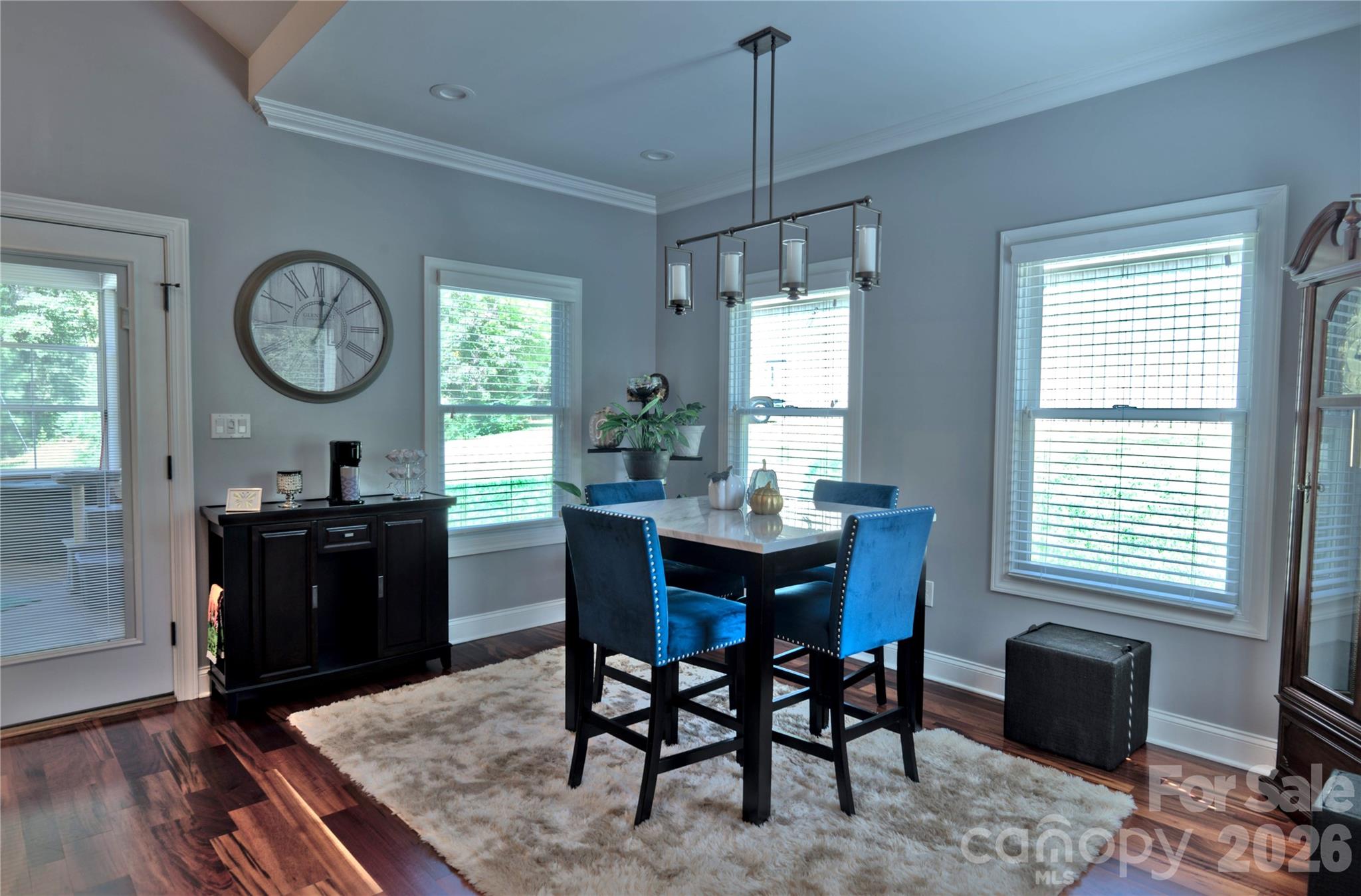 15027 Beatties Ford Road Huntersville, NC 28078 - Photo 15 of 33 a view of a dining room with furniture window and wooden floor