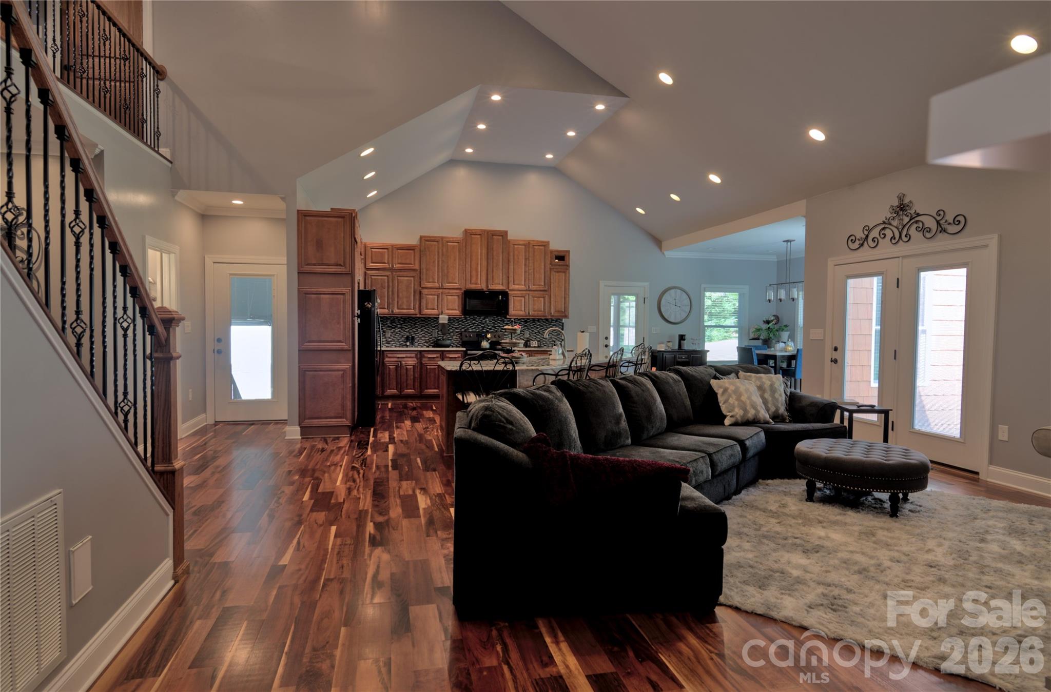 15027 Beatties Ford Road Huntersville, NC 28078 - Photo 16 of 33 a living room with furniture and wooden floor
