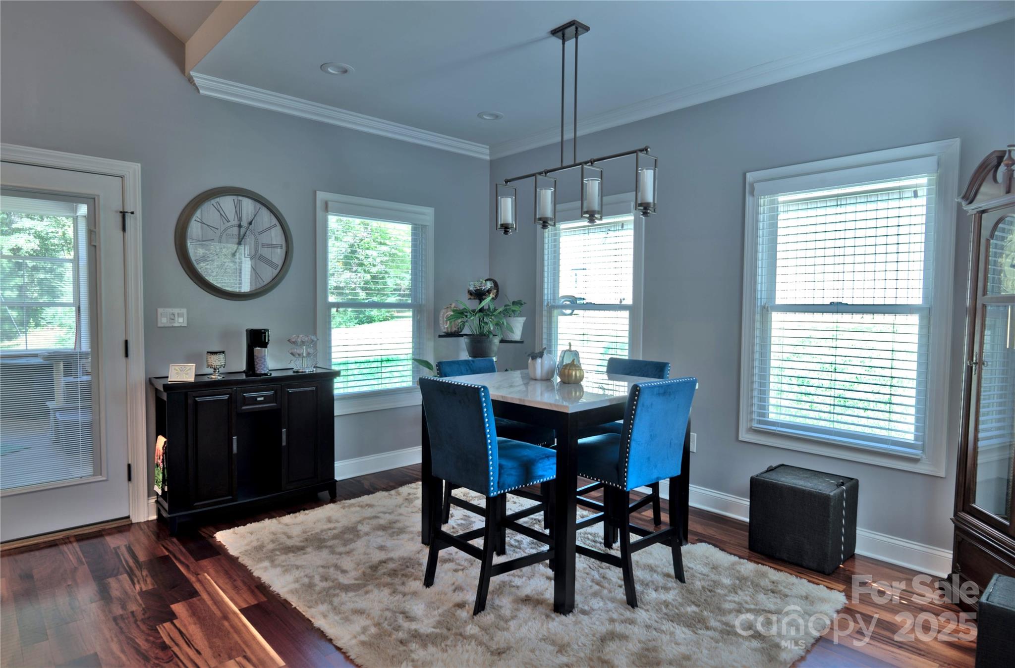 15027 Beatties Ford Road Huntersville, NC 28078 - Photo 18 of 34 a view of a dining room with furniture window and wooden floor