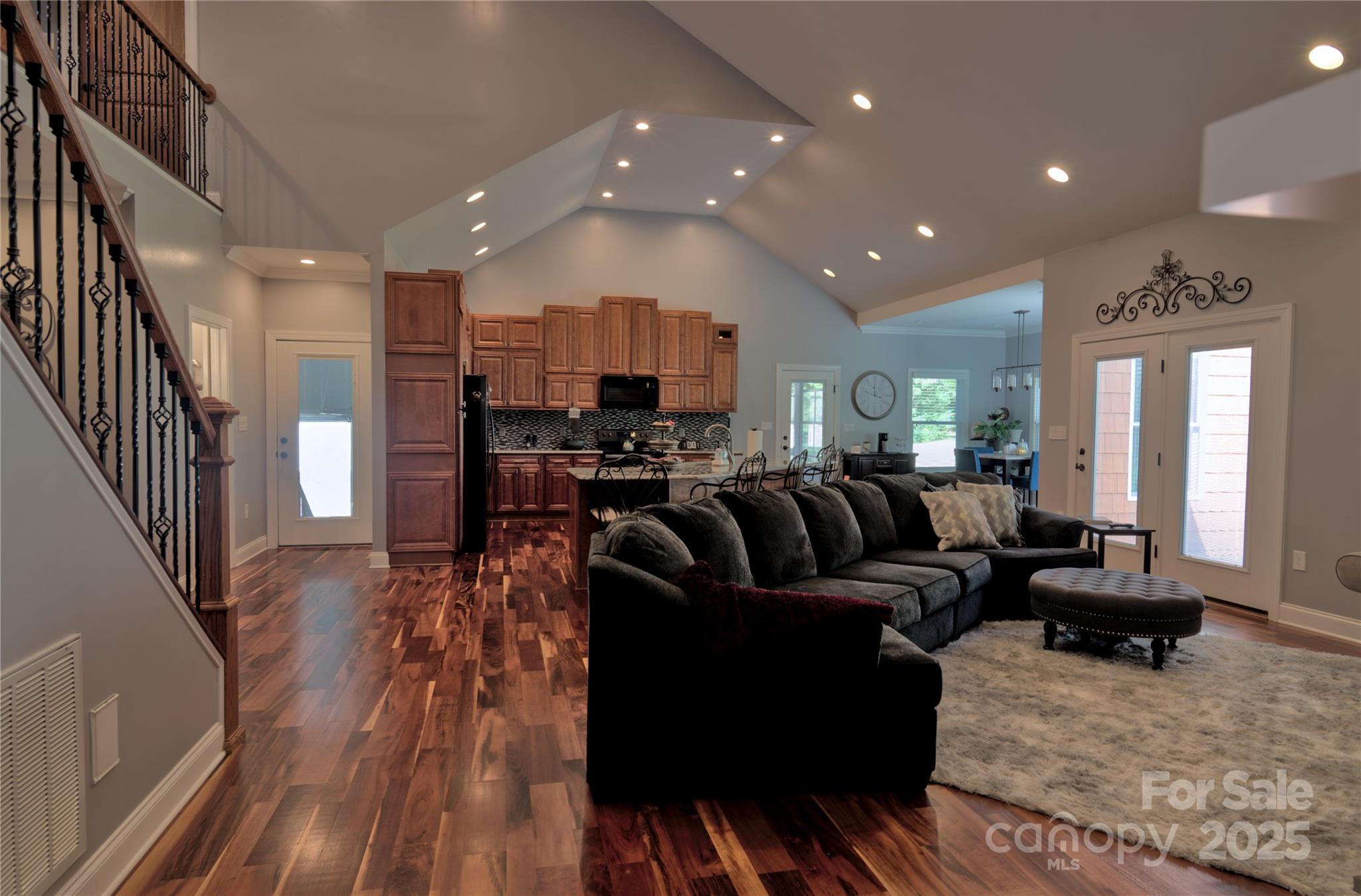 15027 Beatties Ford Road Huntersville, NC 28078 - Photo 19 of 34 a living room with furniture and wooden floor