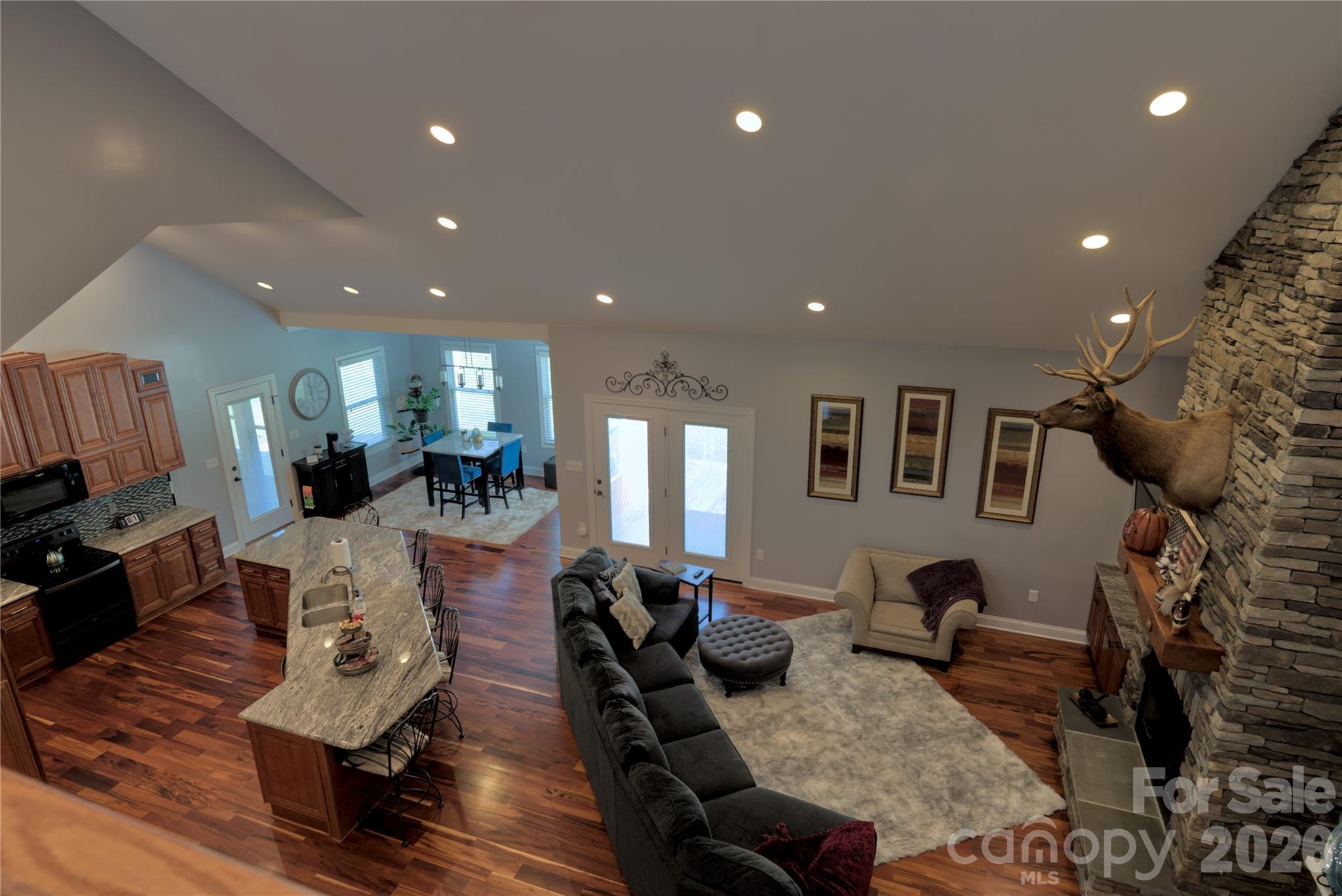 15027 Beatties Ford Road Huntersville, NC 28078 - Photo 19 of 33 a living room with furniture or couch and a wooden floor