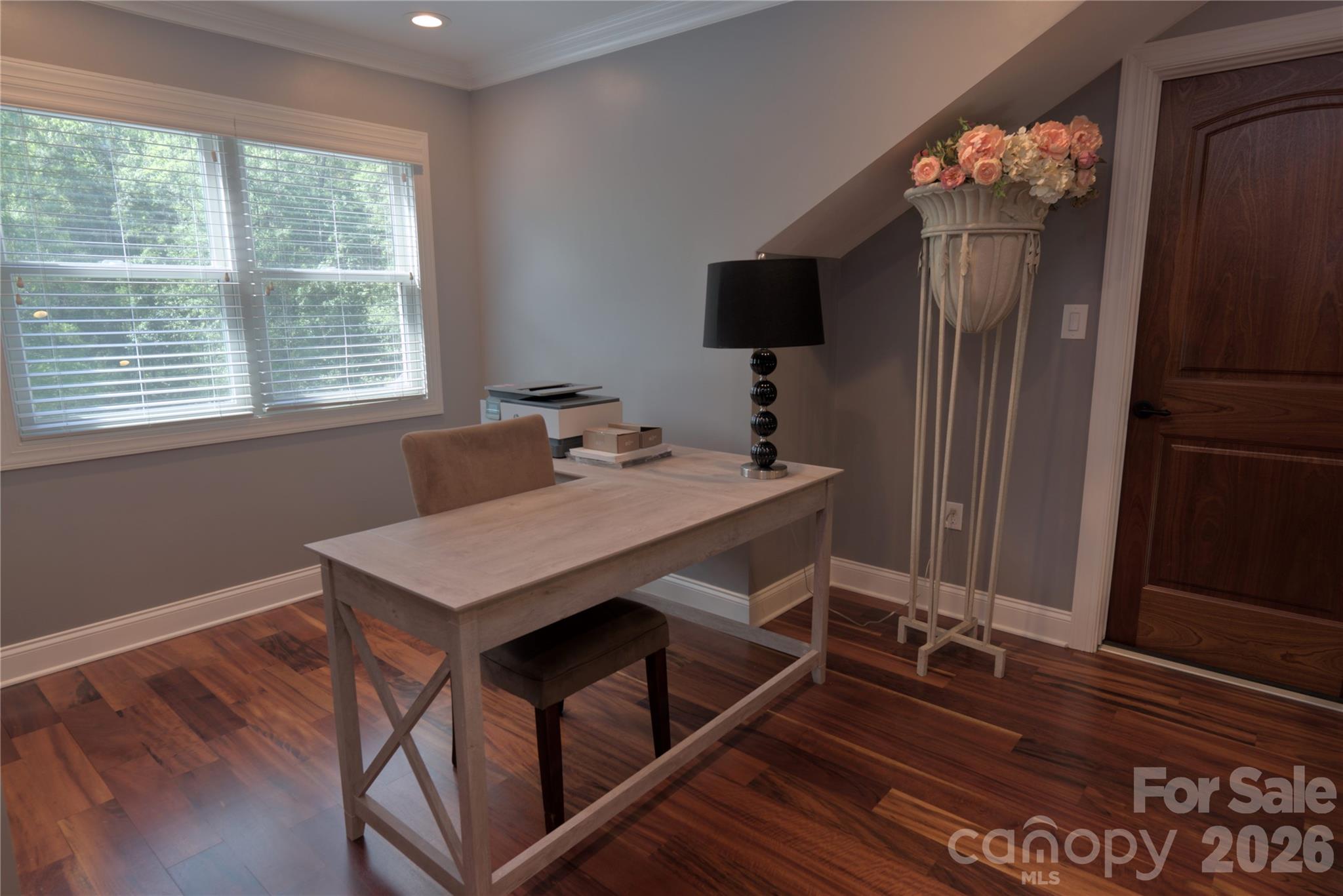 15027 Beatties Ford Road Huntersville, NC 28078 - Photo 20 of 33 a view of a dining room with furniture wooden floor and chandelier