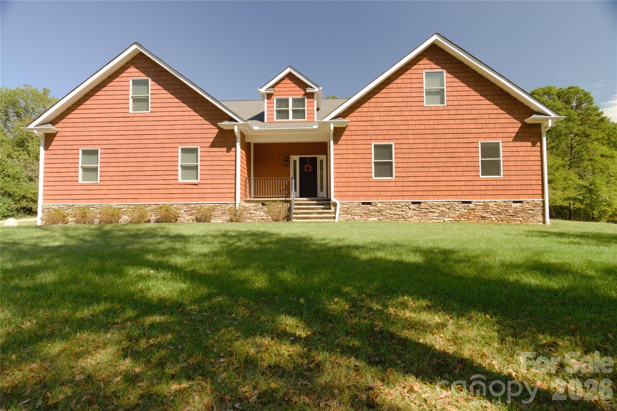 15027 Beatties Ford Road Huntersville, NC 28078 - Photo 2 of 33 a front view of a house with a yard