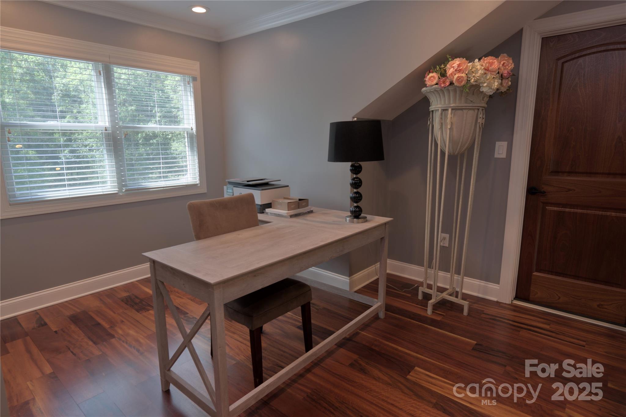 15027 Beatties Ford Road Huntersville, NC 28078 - Photo 23 of 34 a view of a dining room with furniture wooden floor and chandelier