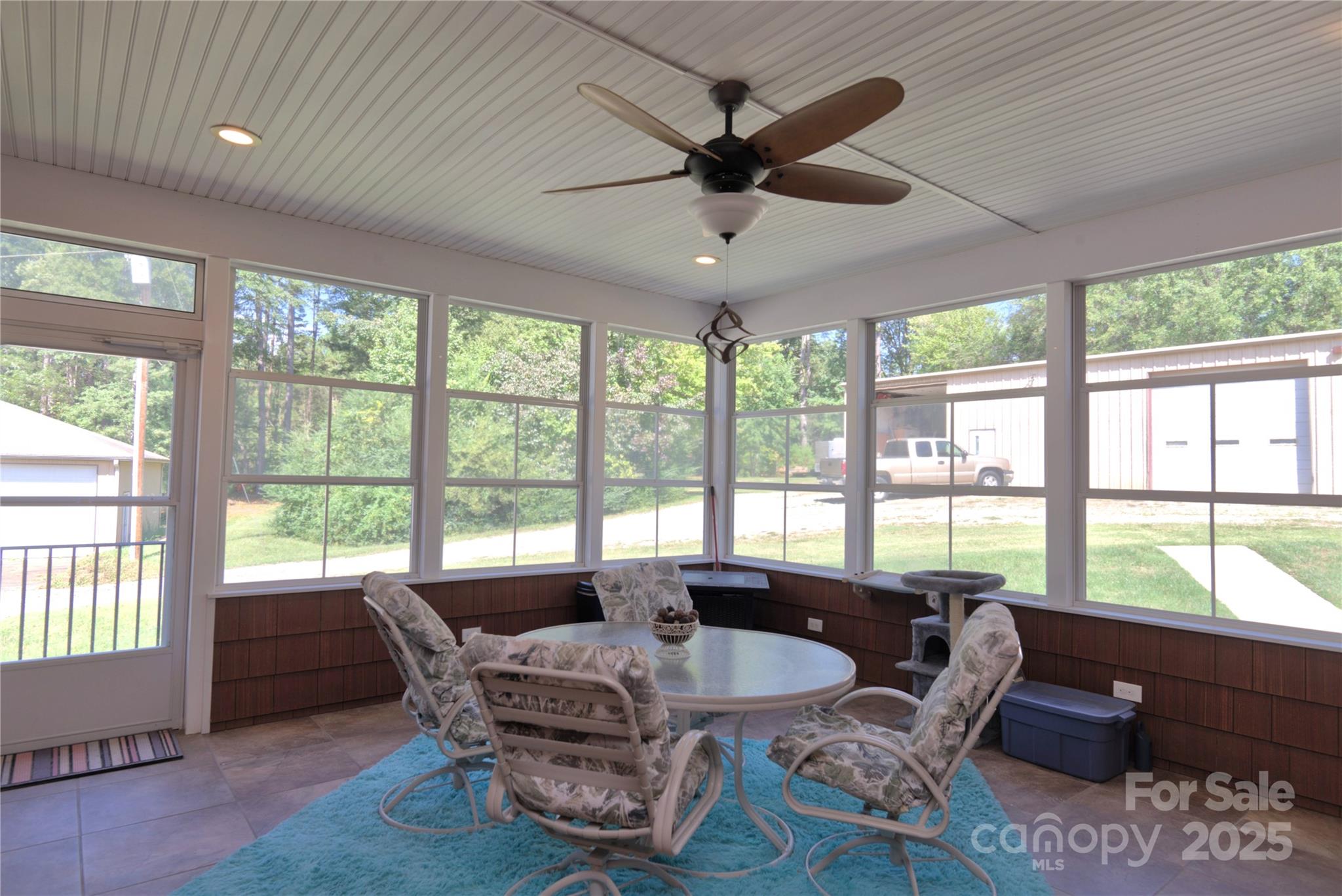 15027 Beatties Ford Road Huntersville, NC 28078 - Photo 30 of 34 a living room with furniture and a large window