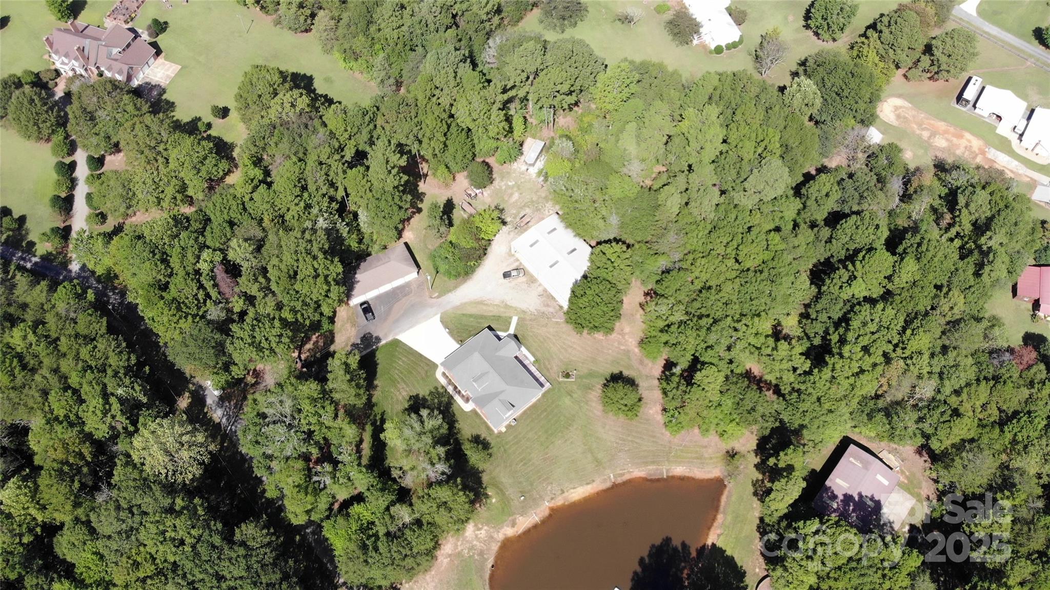15027 Beatties Ford Road Huntersville, NC 28078 - Photo 3 of 34 a view of flowers in a garden