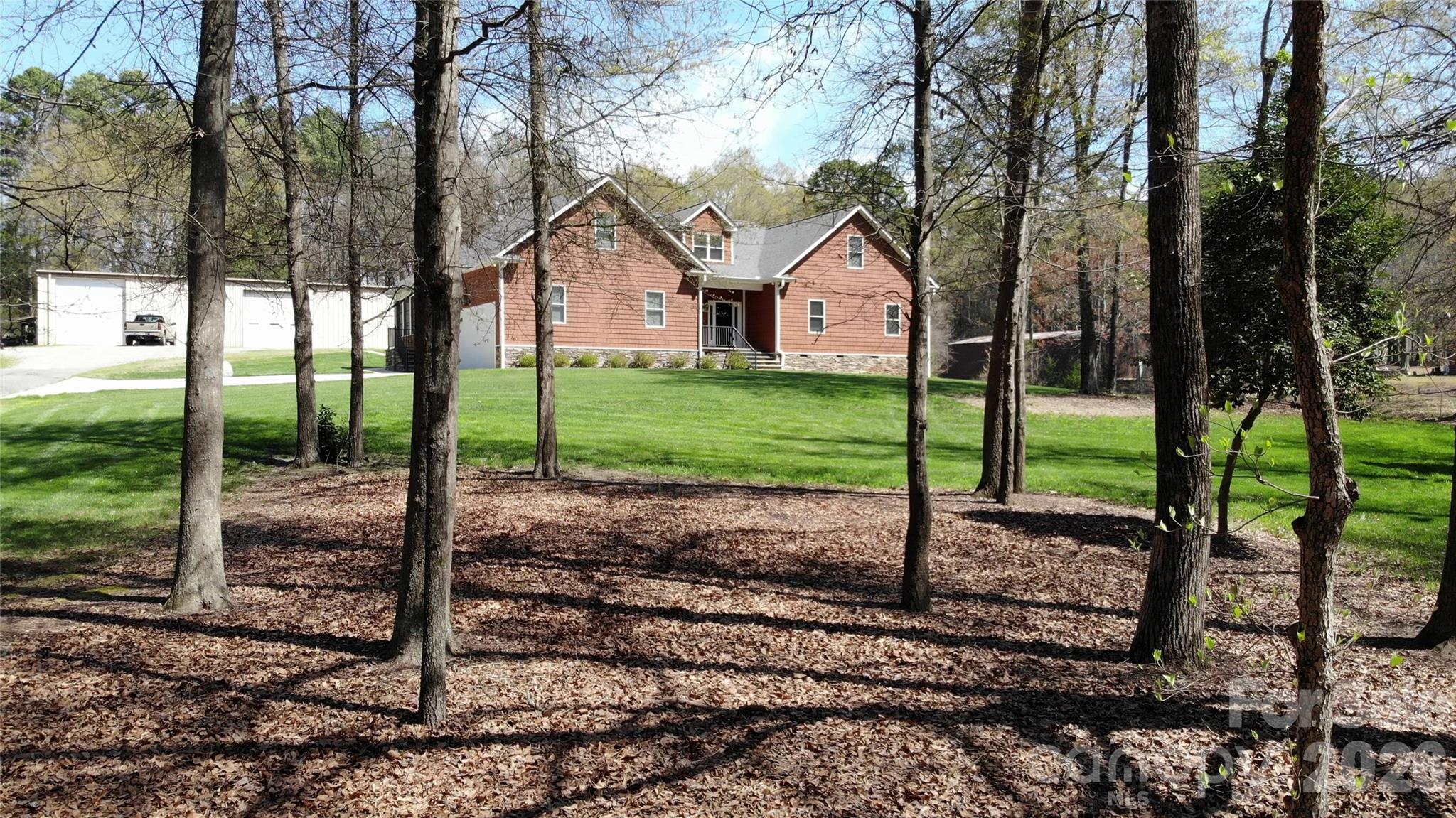 15027 Beatties Ford Road Huntersville, NC 28078 - Photo 3 of 33 a view of a house with a yard