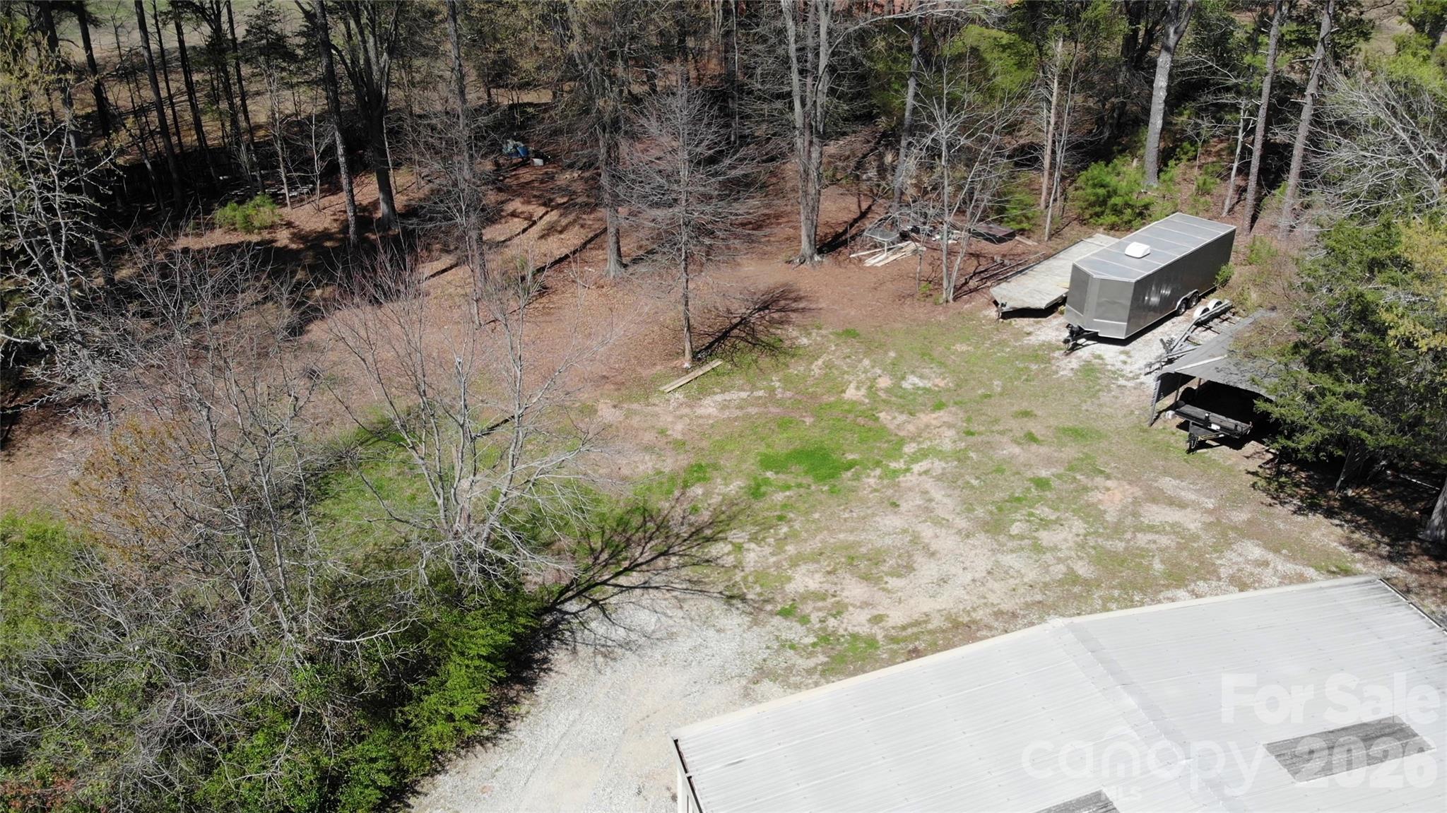 15027 Beatties Ford Road Huntersville, NC 28078 - Photo 32 of 33 a view of a yard with plants and trees