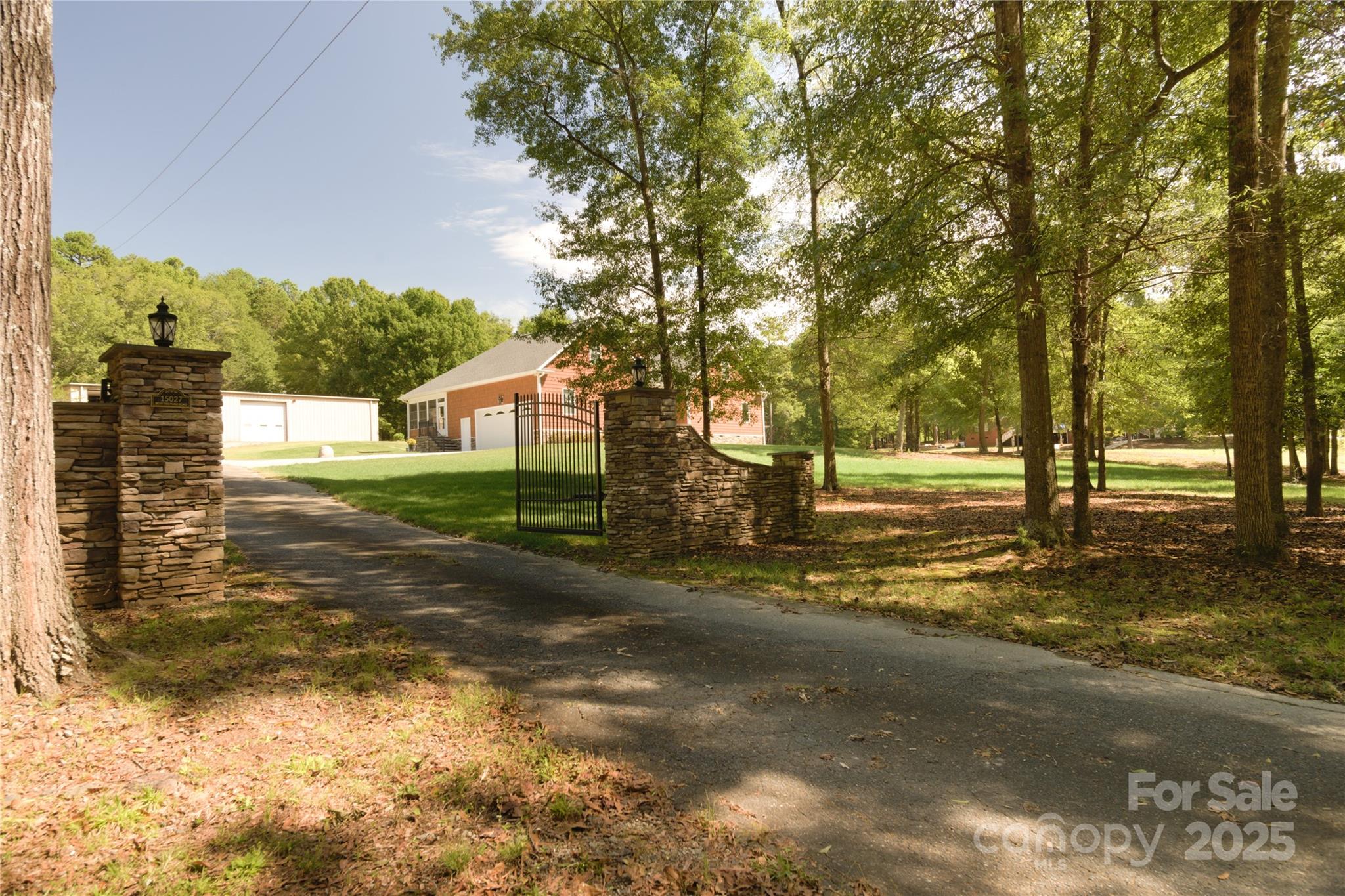 15027 Beatties Ford Road Huntersville, NC 28078 - Photo 4 of 34 a view of street with trees