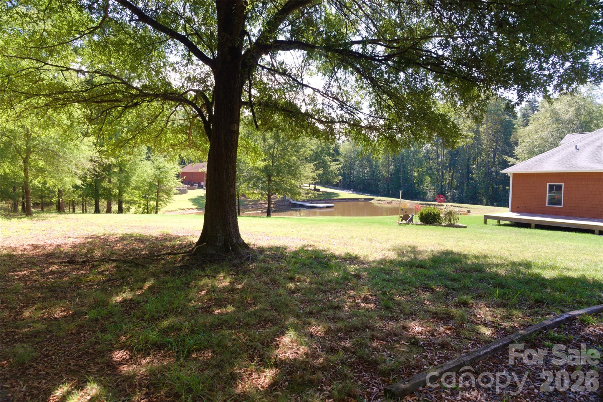 15027 Beatties Ford Road Huntersville, NC 28078 - Photo 8 of 33 a view of yard with trees