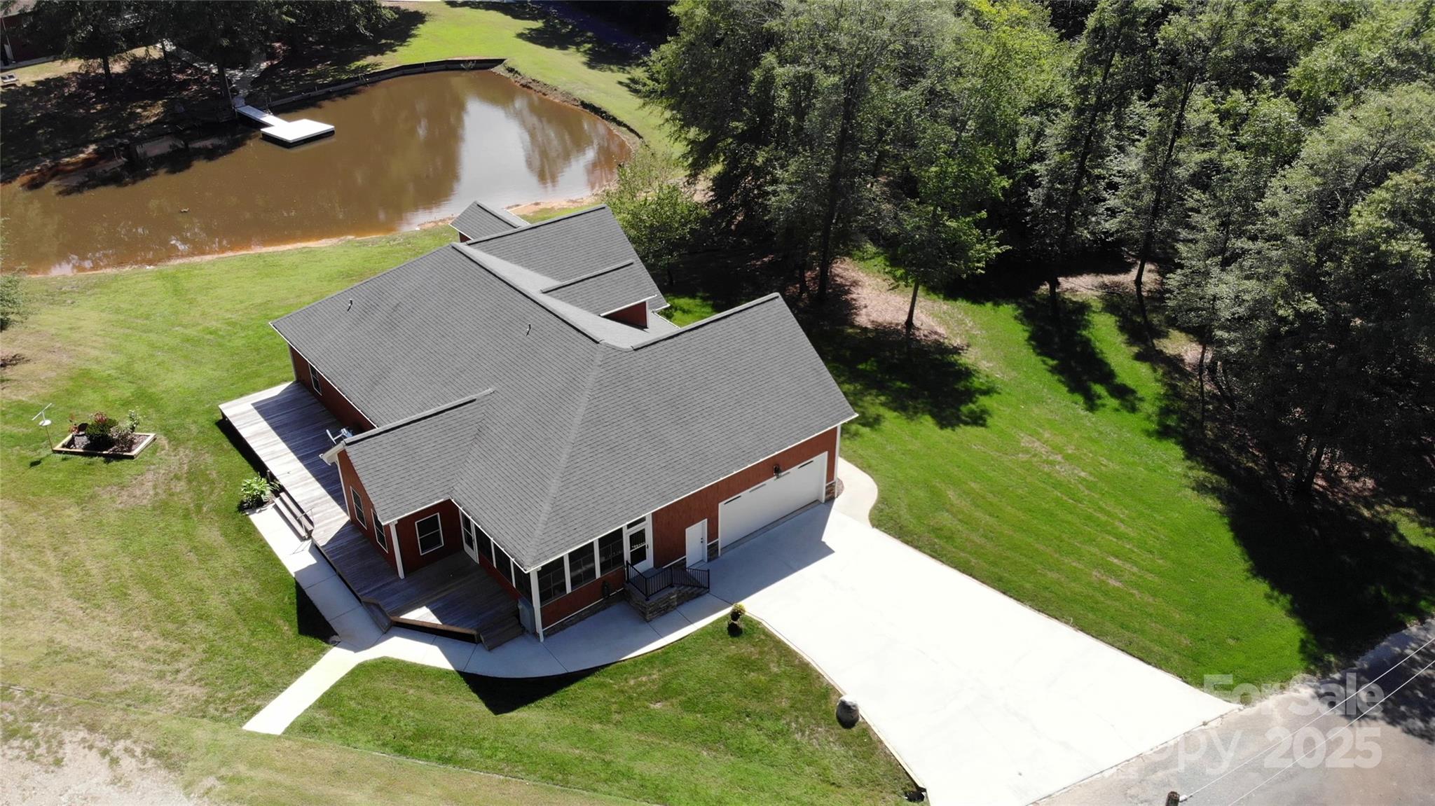 15027 Beatties Ford Road Huntersville, NC 28078 - Photo 9 of 34 an aerial view of a house with a yard basket ball court and outdoor seating