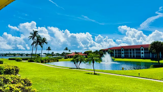 a view of a porch with a floor to ceiling windows and yard