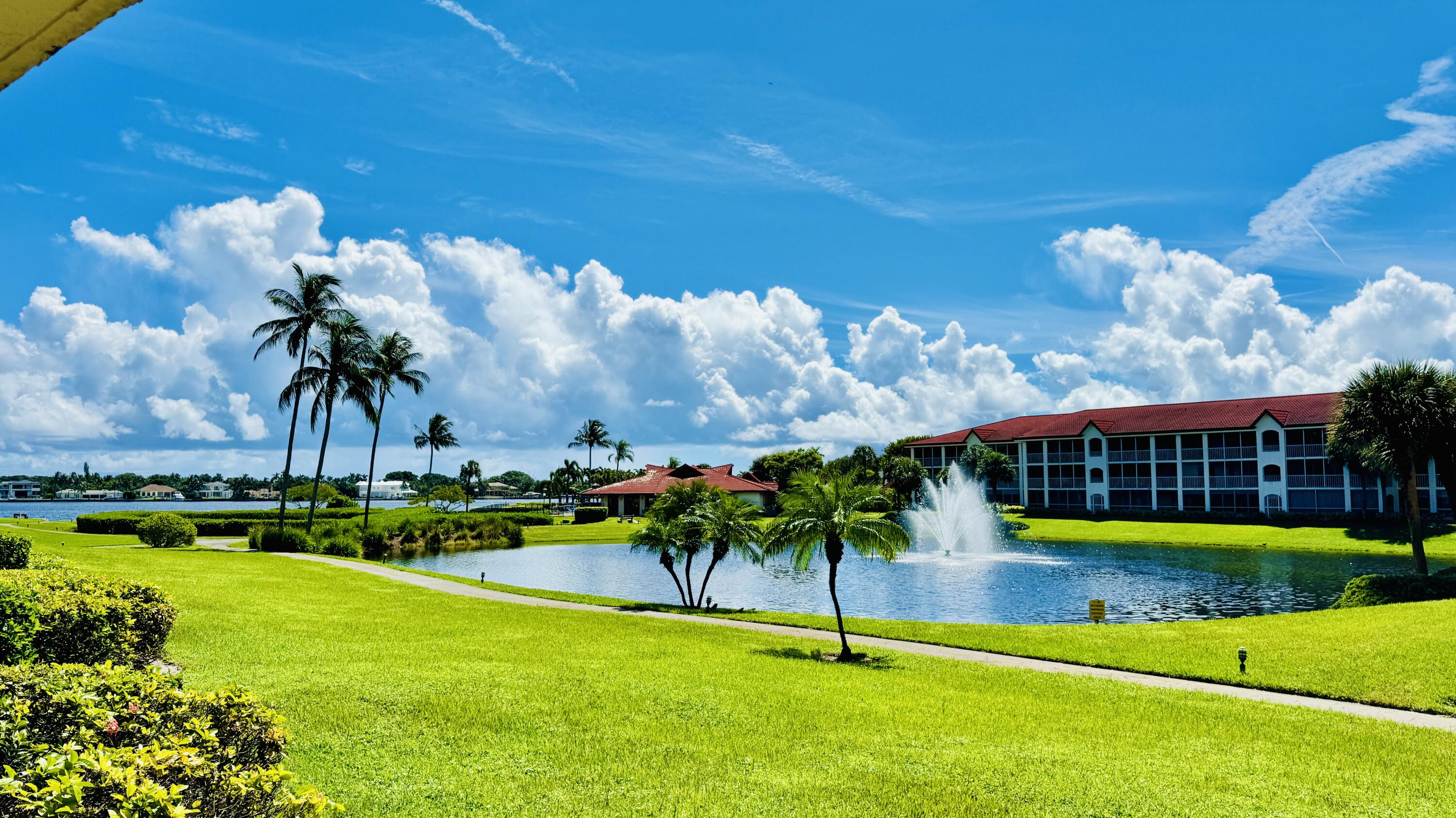7030 Half Moon Circle, Unit 121 Hypoluxo, FL 33462 - Photo 27 of 74 a view of a house with a swimming pool