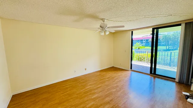 a kitchen with stainless steel appliances granite countertop a refrigerator a stove and a sink