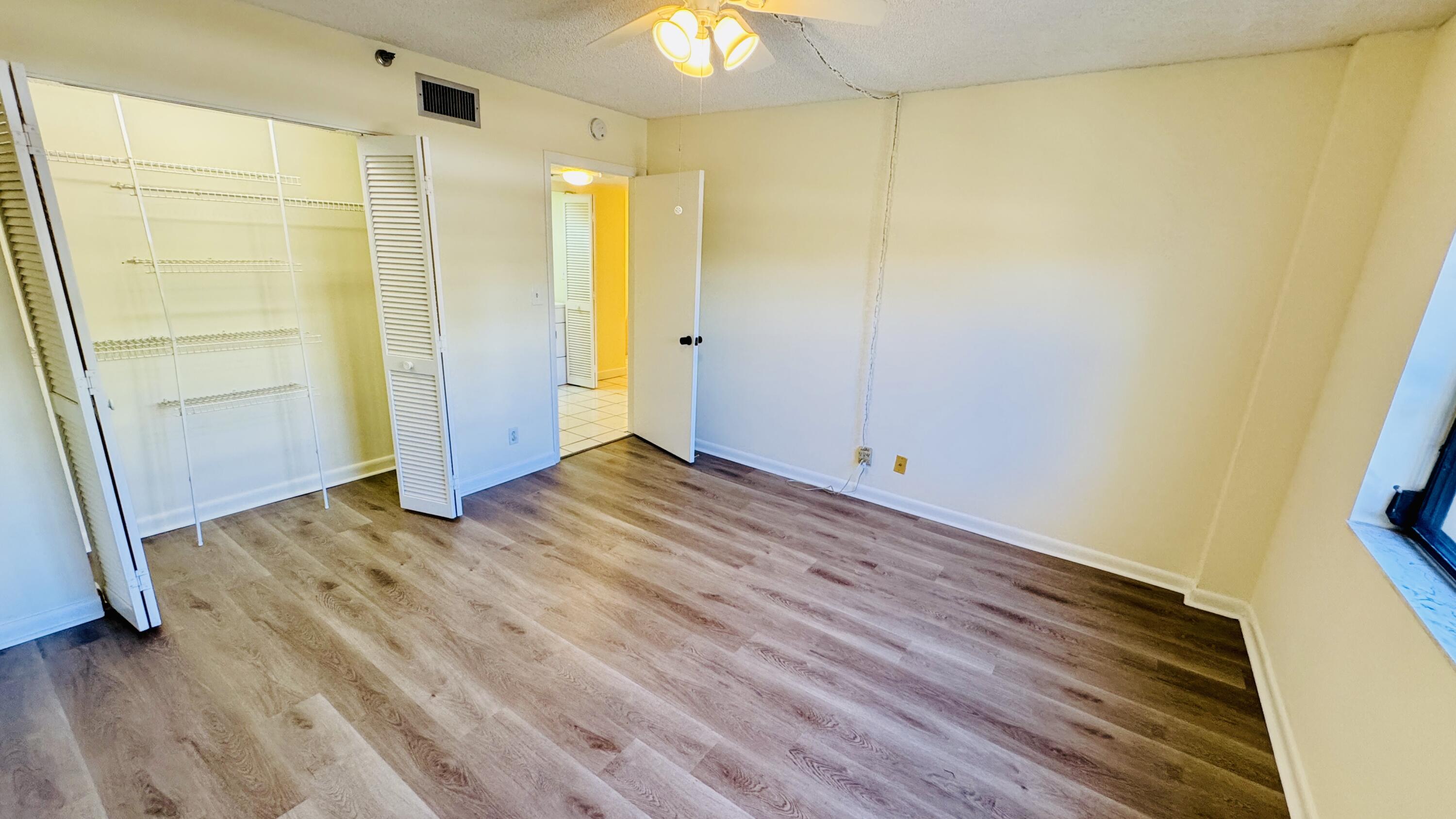 7030 Half Moon Circle, Unit 121 Hypoluxo, FL 33462 - Photo 50 of 74 a view of a bathroom with a tub and a shower