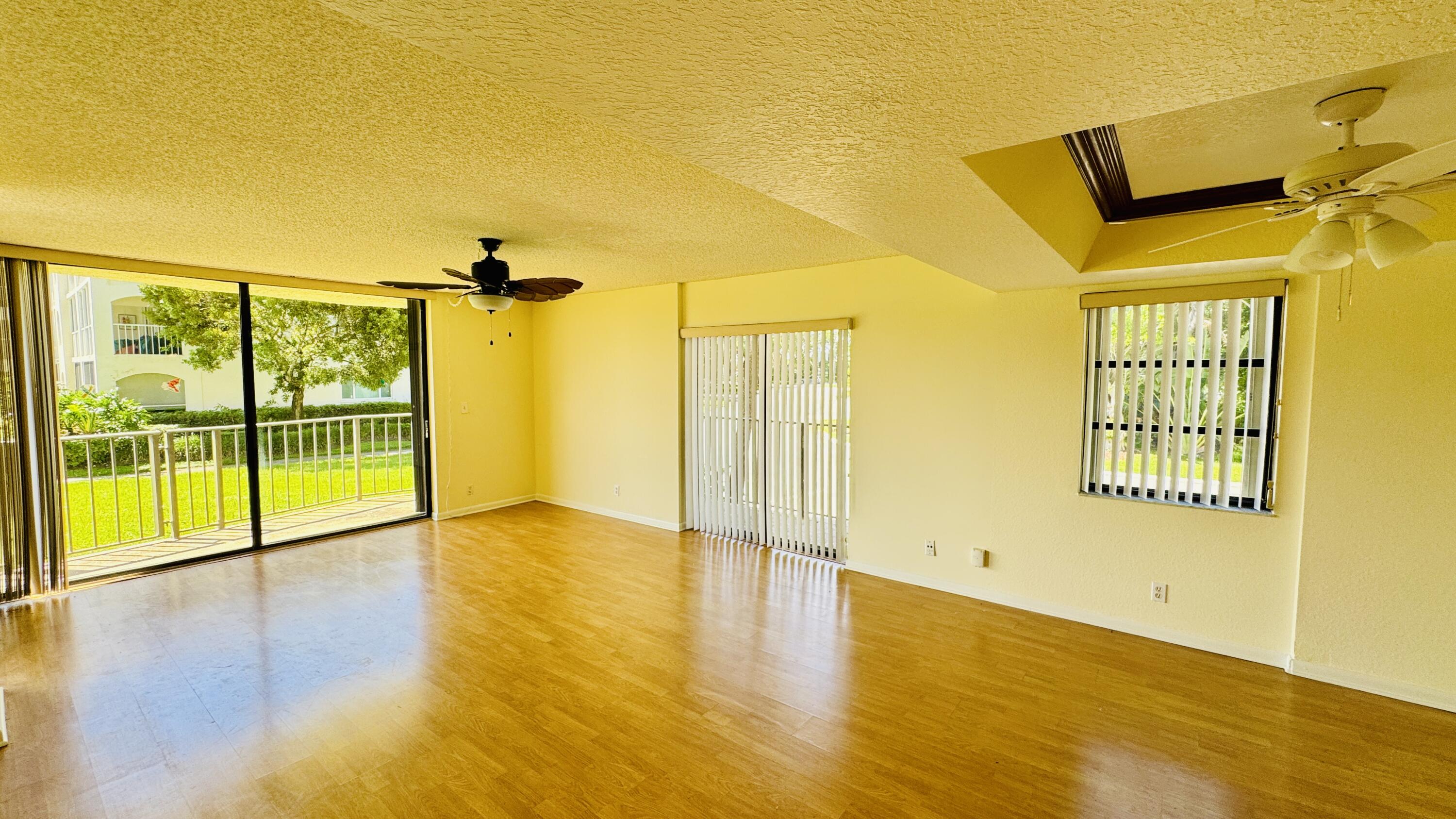 7030 Half Moon Circle, Unit 121 Hypoluxo, FL 33462 - Photo 66 of 74 a view of an empty room with a window