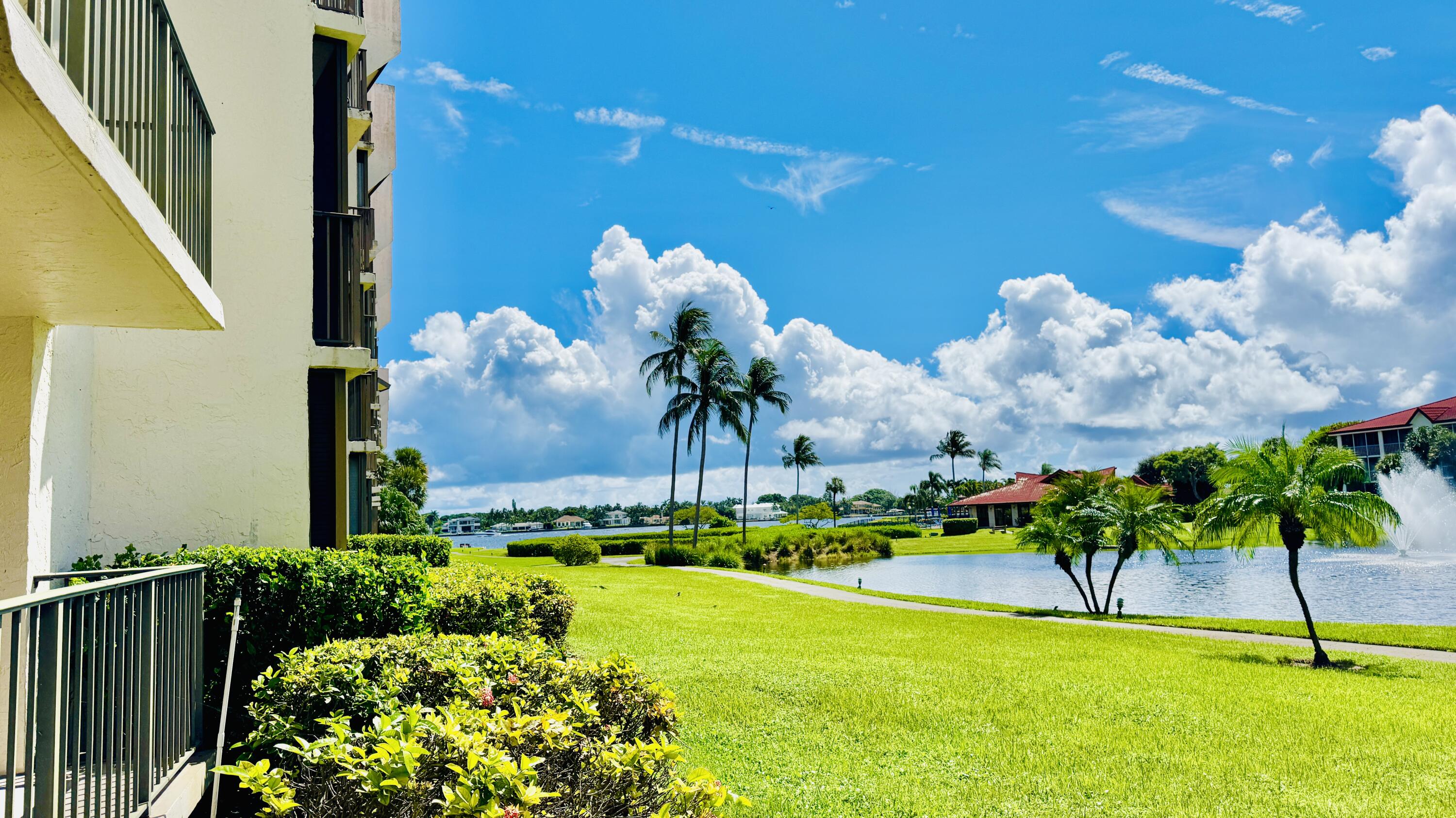 7030 Half Moon Circle, Unit 121 Hypoluxo, FL 33462 - Photo 71 of 74 a view of a flower in a yard