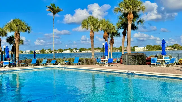a view of swimming pool with a table and chairs