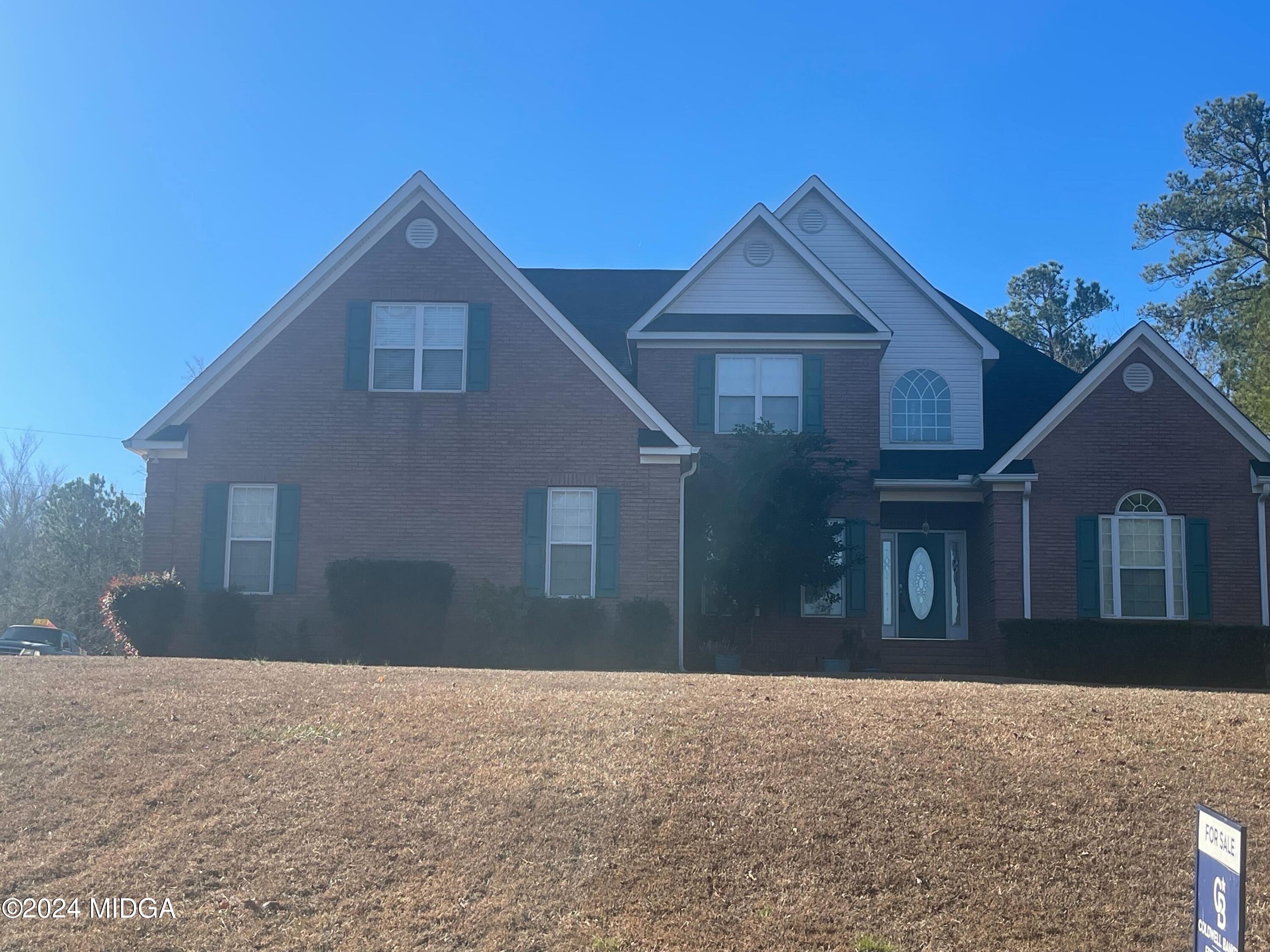 151 Gates Road Lizella, GA 31052 - Photo 6 of 9 a front view of a house with a yard and garage