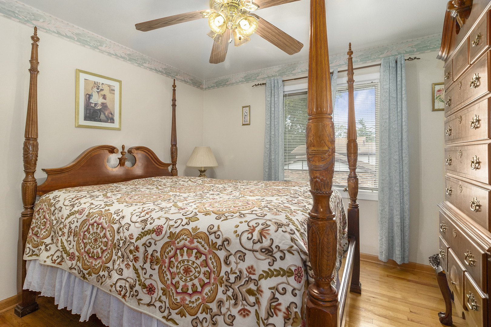 1319 Elder Road Homewood, IL 60430 - Photo 13 of 24 a bedroom with a bed and a chandelier