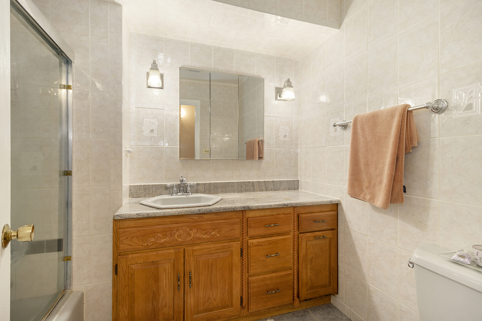 1319 Elder Road Homewood, IL 60430 - Photo 14 of 24 a bathroom with a sink and a mirror