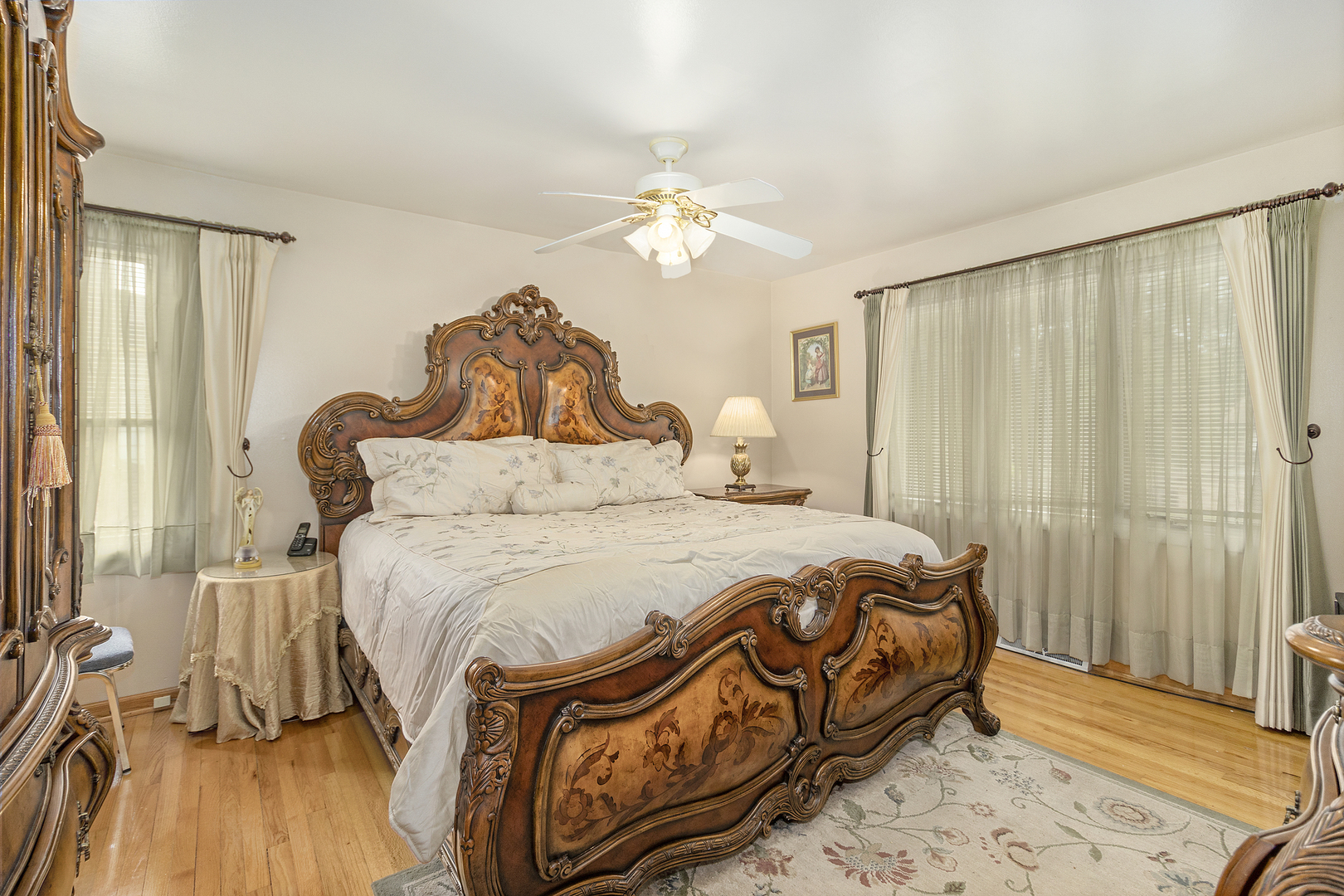 1319 Elder Road Homewood, IL 60430 - Photo 15 of 24 a bedroom with a bed and a chandelier