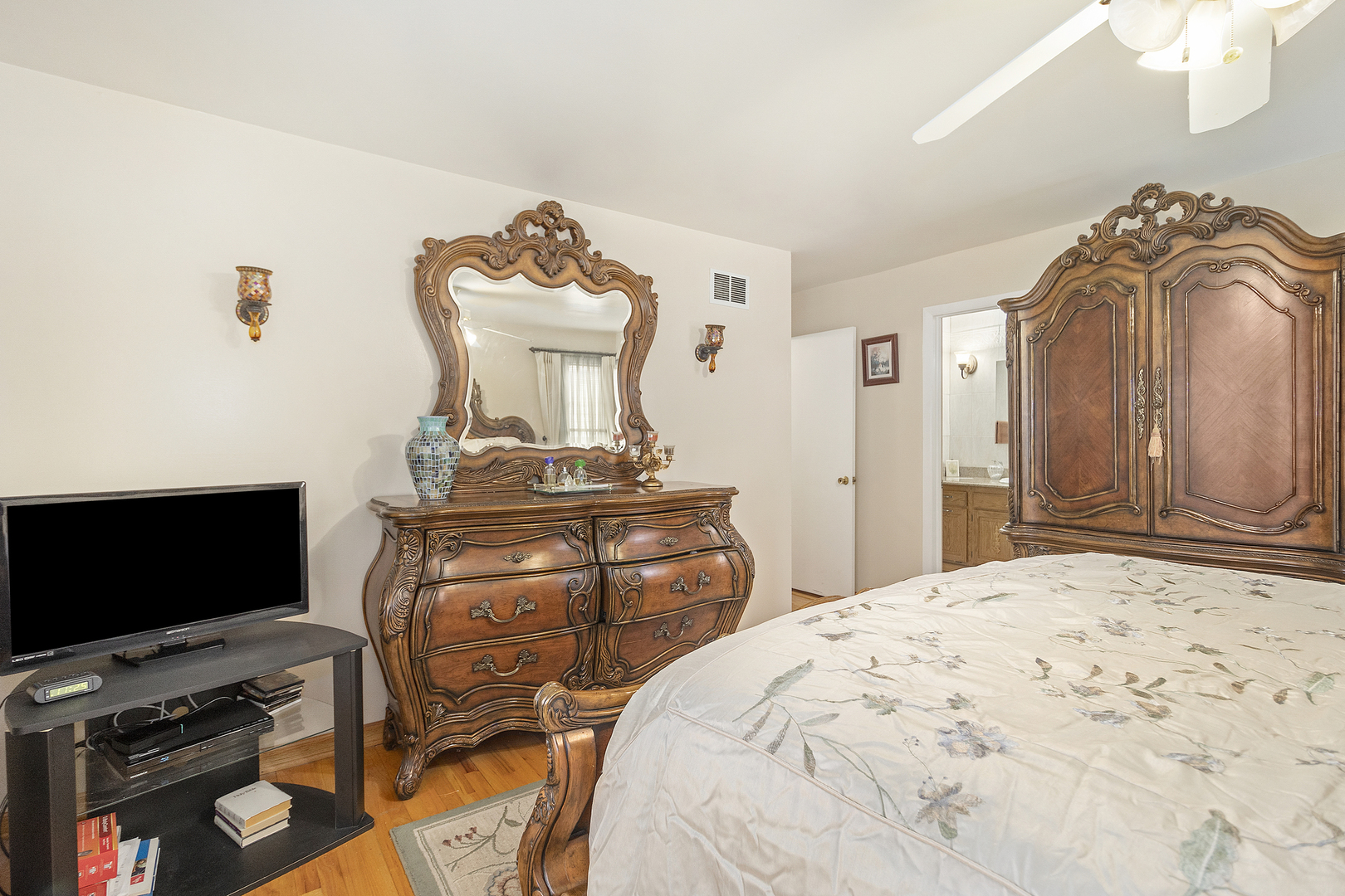 1319 Elder Road Homewood, IL 60430 - Photo 16 of 24 a bedroom with a bed and flat screen tv