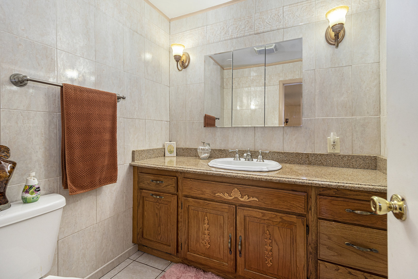 1319 Elder Road Homewood, IL 60430 - Photo 17 of 24 a bathroom with a granite countertop sink a toilet and shower