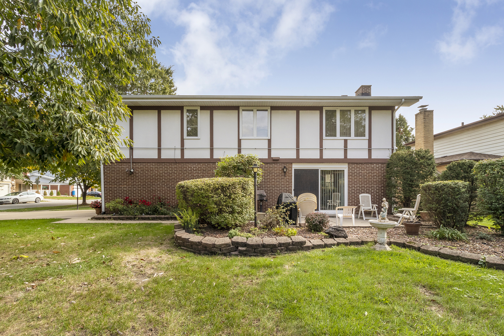 1319 Elder Road Homewood, IL 60430 - Photo 24 of 24 a front view of a house with sitting area and garden