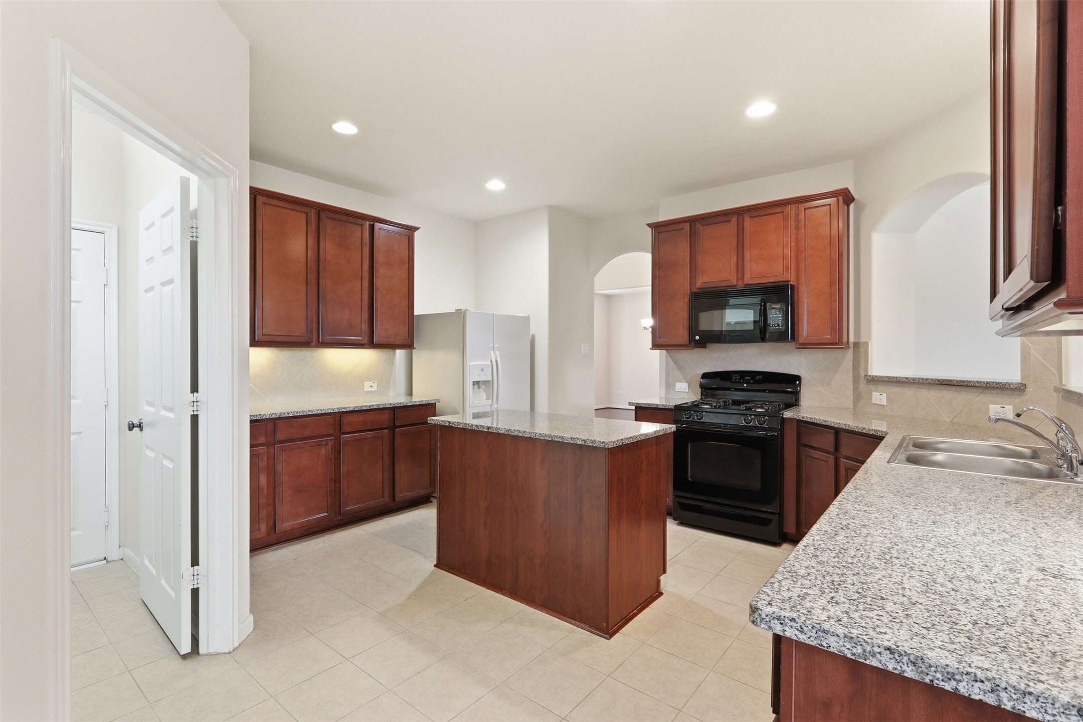1911 Vale Brook Drive Spring, TX 77373 - Photo 5 of 27 The centrally located kitchen offers generous counter space while overlooking both the breakfast area and living room.