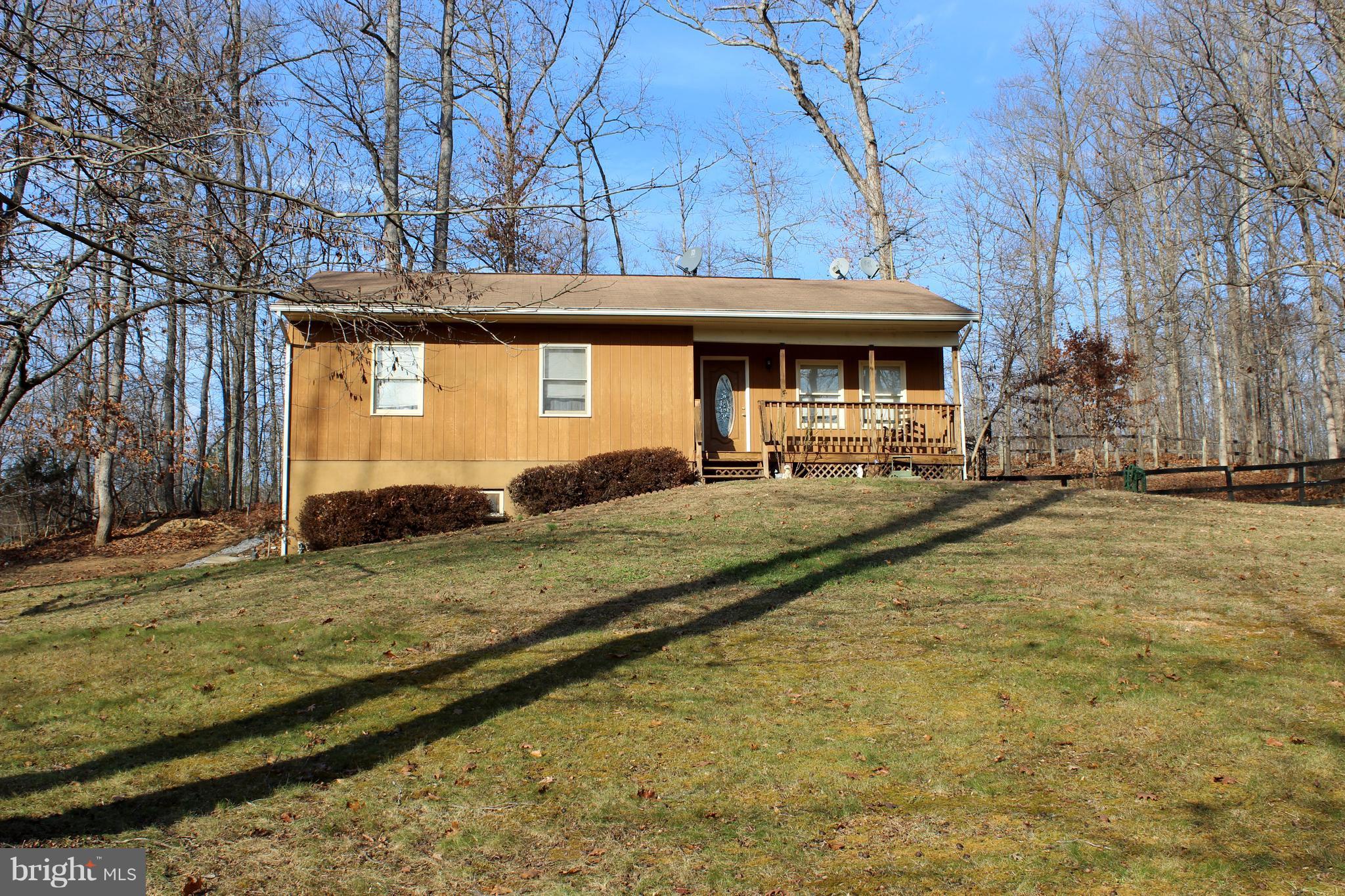 10311 River Road Rixeyville, VA 22737 - Photo 2 of 30 a front view of a house with a yard