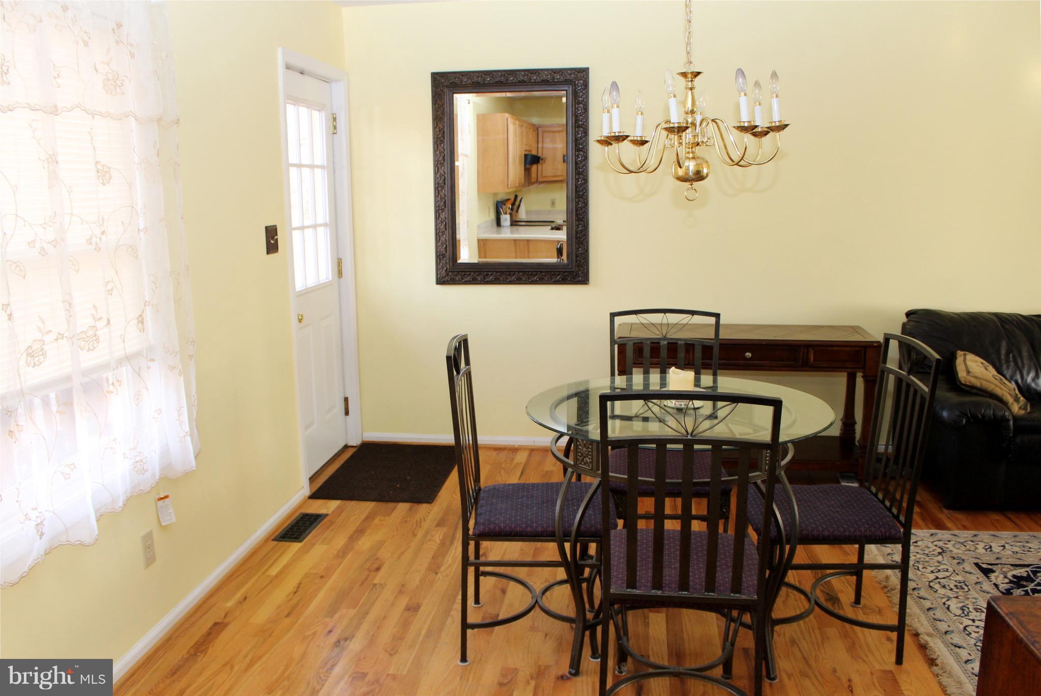 10311 River Road Rixeyville, VA 22737 - Photo 11 of 30 a view of a dining room with furniture and wooden floor