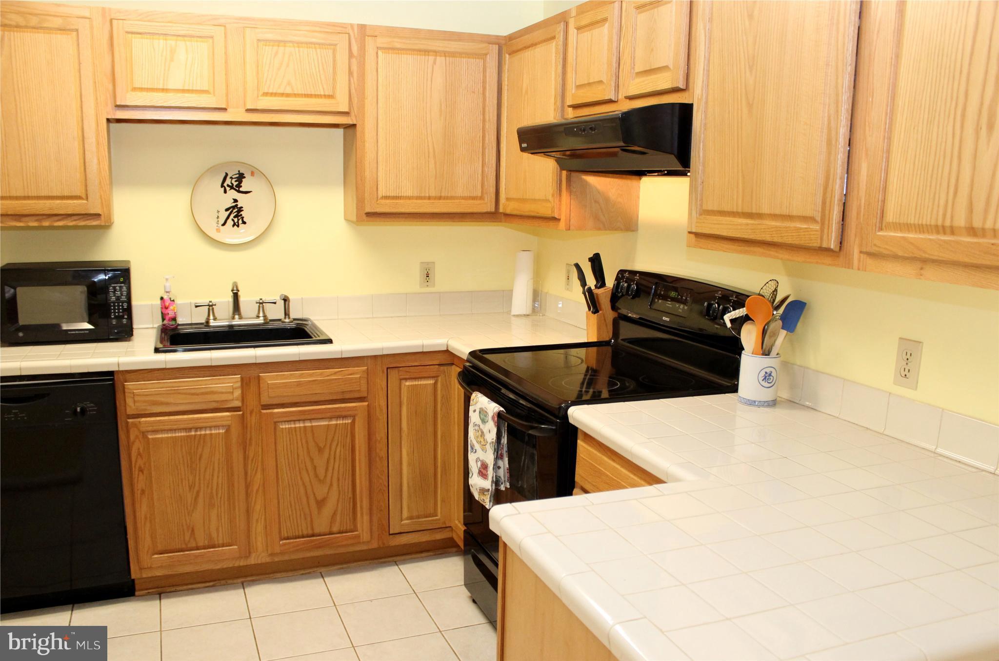 10311 River Road Rixeyville, VA 22737 - Photo 14 of 30 a kitchen with stainless steel appliances a sink a stove and cabinets