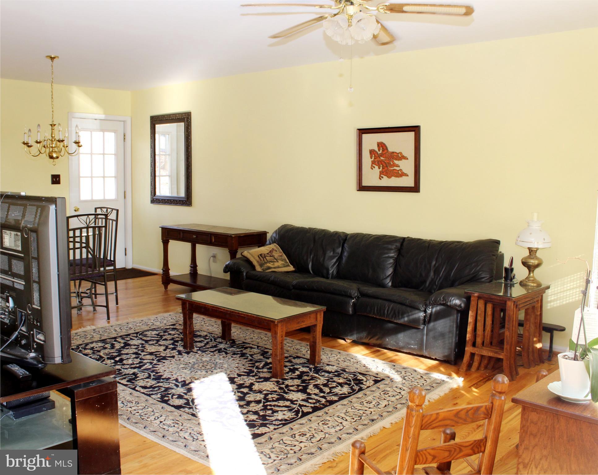 10311 River Road Rixeyville, VA 22737 - Photo 6 of 30 a living room with furniture and a rug