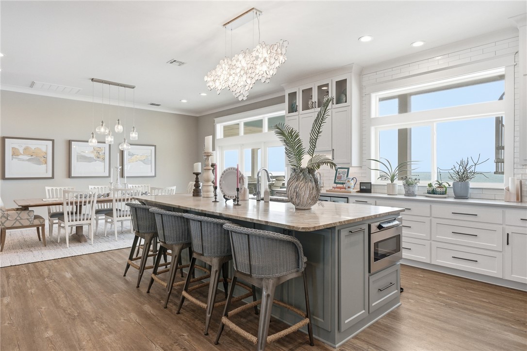12 Sea Shell Shores Rockport, TX 78382 - Photo 11 of 40 a kitchen with center island table and chairs in it