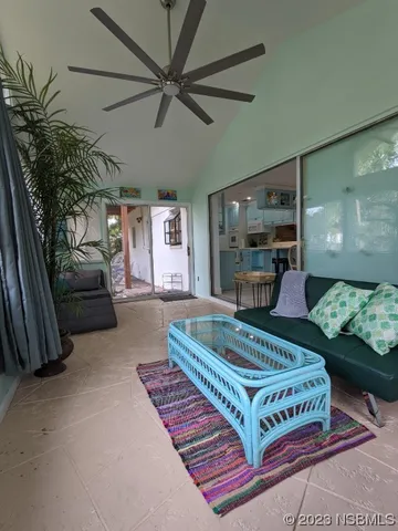 a kitchen with a table chairs refrigerator and cabinets