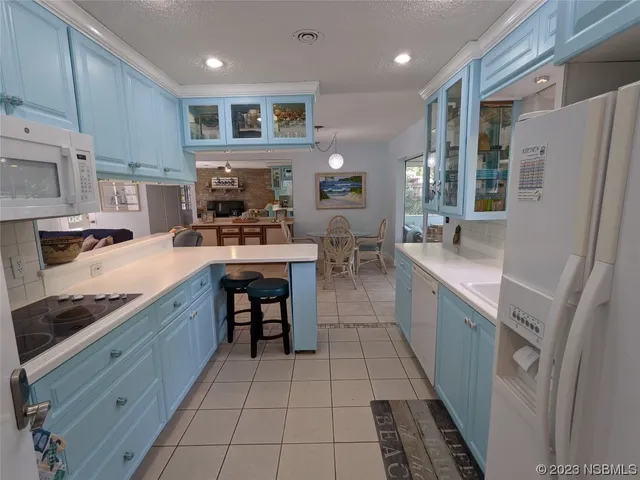 a bedroom with a bed and a flat tv screen