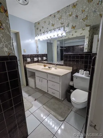 a bedroom with a bed and lamp with window